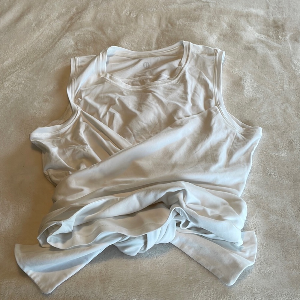 Lululemon white sleeveless wrap top.